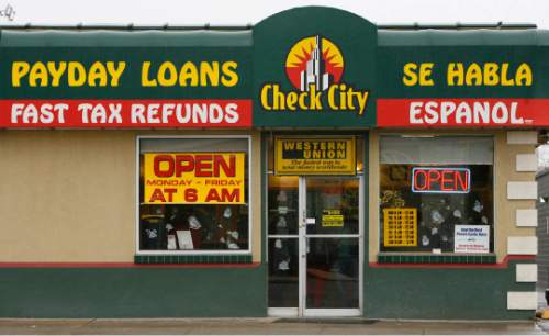 Leah Hogsten  |  Tribune file photo
Payday loan company Check City operates at 2120 S. State St. in Salt Lake City. After years of having a relatively free reign in the state, legislative remedies are on the horizon and several cities have capped the number of  payday loan industry outlets. The stores are and depict to whom the industry caters.