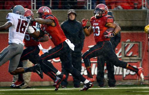 Scott Sommerdorf   |  The Salt Lake Tribune
Utah RB Devontae Booker sprints 76 yards for a TD following great blocking from Dres Anderson and Kenneth Scott as Utah took a quick 21-0 lead over Washington State in the first quarter, Saturday, September 27, 2014.