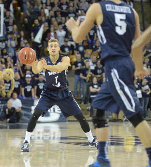 Steve Griffin  |  The Salt Lake Tribune

Brigham Young Cougars guard Chase Fischer (1) passes to Brigham Young Cougars guard Kyle Collinsworth (5) during first half action in the BYU versus USU men's basketball game in Logan, Tuesday, December 2, 2014.