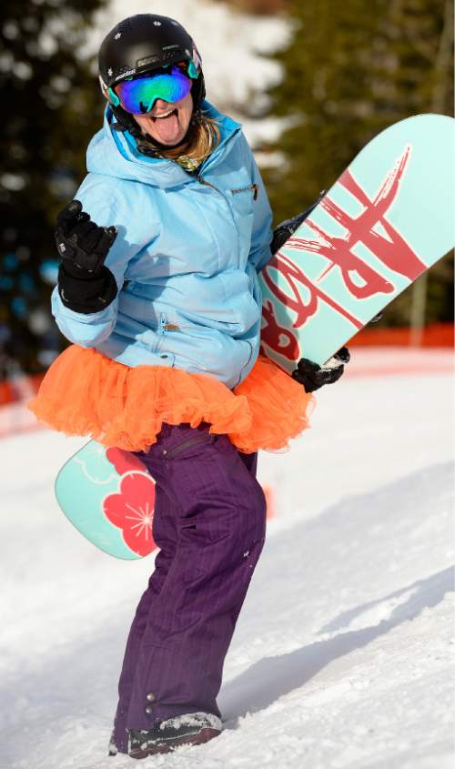 Leah Hogsten  |  The Salt Lake Tribune
"I have so much fun on my adventures that I just always want to keep it going," said Becky Nix of her drive to keep snowboarding every month for the past eight years. Nix catches air Friday, December 5, 2014 at Snowbird Resort on her 110th consecutive month snowboarding.