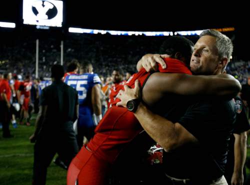Trent Nelson  |  The Salt Lake Tribune
Utah Utes head coach Kyle Whittingham embraces Utah Utes wide receiver Anthony Denham (8) after the win as the BYU Cougars host the Utah Utes, college football Saturday, September 21, 2013 at LaVell Edwards Stadium in Provo.