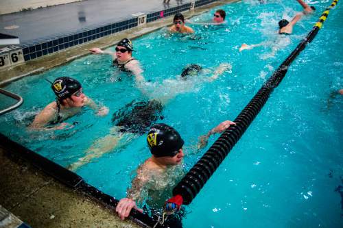 Chris Detrick  |  The Salt Lake Tribune
Sophomore Kale Walker lets his teammates pass him in the pool while they swim warm-up laps at Wasatch High School Swimming Pool Thursday January 15, 2015.  Walker has been blind since birth and this is his first year on the Wasatch swim team.