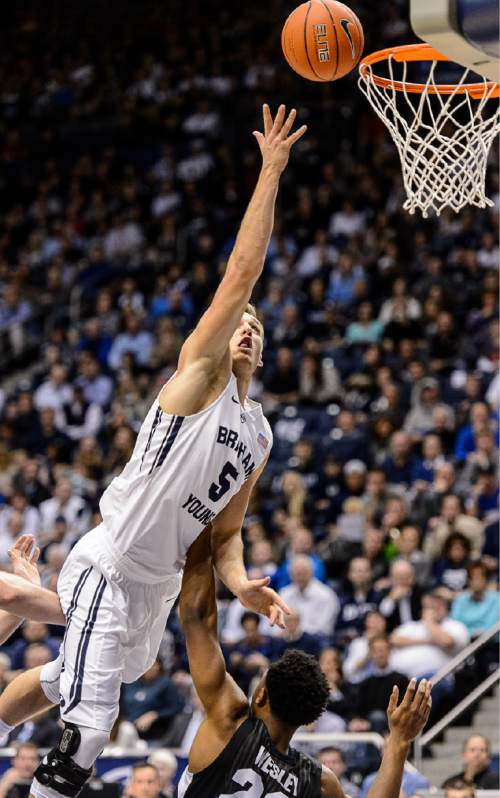 Trent Nelson  |  The Salt Lake Tribune
Brigham Young Cougars guard Kyle Collinsworth (5) puts a shot up over Gonzaga Bulldogs guard Byron Wesley (22) as BYU hosts Gonzaga, men's college basketball at the Marriott Center in Provo, Saturday December 27, 2014.