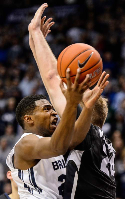 Trent Nelson  |  The Salt Lake Tribune
Brigham Young Cougars guard Anson Winder (20), defended by Gonzaga Bulldogs center Przemek Karnowski (24) as BYU hosts Gonzaga, men's college basketball at the Marriott Center in Provo, Saturday December 27, 2014.