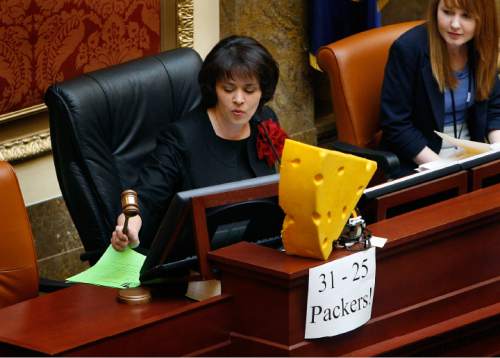 Scott Sommerdorf  |  The Salt Lake Tribune
Speaker of the House Becky Lockhart (R; Provo) lowers the gavel to start the morning session in the Utah House of Representatives, Monday, February 7, 2011. On her desk is a cheesehead balanced over a Pittsburgh Steelers mini helmet, recognizing the Packers win in yesterday's Super Bowl.