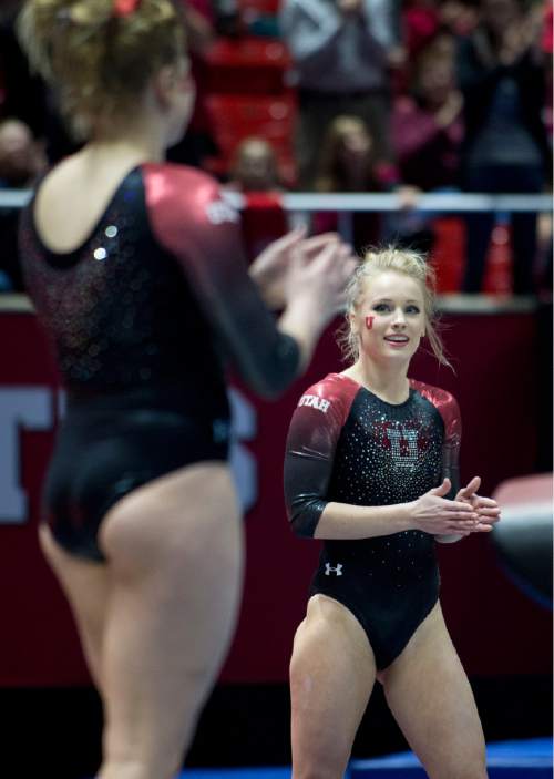 Lennie Mahler  |  The Salt Lake Tribune
Teammates and fans applaud after judges award Georgia Dabritz a 9.950 for her floor routine, including a 10 from one judge, during a super meet at the Huntsman Center on Friday, Jan. 16, 2015.