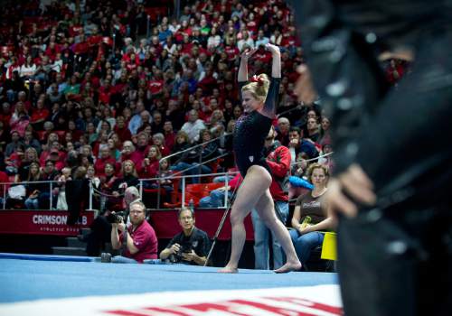 Lennie Mahler  |  The Salt Lake Tribune
Tory Wilson scores a 9.850 on her floor routine during a super meet at the Huntsman Center on Friday, Jan. 16, 2015.