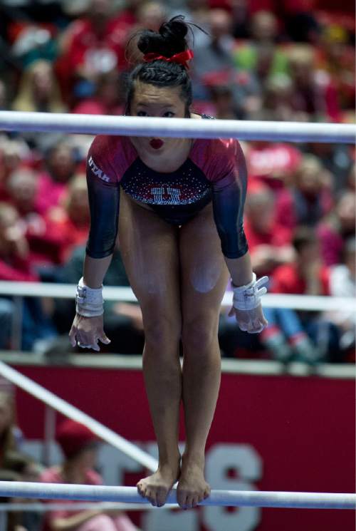 Lennie Mahler  |  The Salt Lake Tribune
Kari Lee performs an exhibition routine on the bars during a super meet at the Huntsman Center on Friday, Jan. 16, 2015.