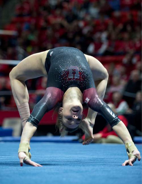Lennie Mahler  |  The Salt Lake Tribune
Tiffani Lewis kips up in an exhibition routine on the floor during a super meet at the Huntsman Center on Friday, Jan. 16, 2015.