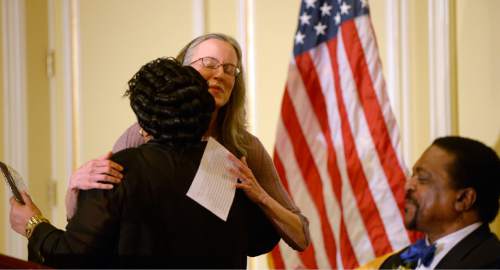 Al Hartmann  |  The Salt Lake Tribune
Anna Burkholder, chief executive officer of YWCA Utah, accepts the Rosa Parks Award at the 31st annual Dr. Martin Luther King Jr. Memorial luncheon in Salt Lake City Monday January 19.  She gets a hug from Jeanetta Williams, President of the Salt Lake NAACP branch.