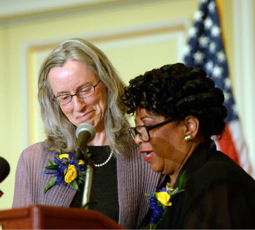 Al Hartmann  |  The Salt Lake Tribune
Anna Burkholder, chief executive officer of YWCA Utah, left, accepts the Rosa Parks Award at the 31st annual Dr. Martin Luther King Jr. Memorial luncheon in Salt Lake City Monday January 19  from Jeanetta Williams, President of the Salt Lake NAACP branch.