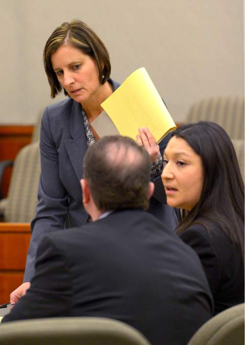 Leah Hogsten  |  The Salt Lake Tribune
Prosecuting attorney Susan Hunt (top)confers with her co-counsel during Brianne Altice's preliminary hearing in Judge John R. Morris' 2nd District Court, Thursday January 15, 2015.  Altice was taken into custody and is headed to trial with 10 felony counts for alleged sexual relationships with three teens: five counts of first-degree felony rape, two counts of first-degree felony forcible sodomy and three counts of second-degree felony forcible sexual abuse in connection with allegedly having sex with the three male students.