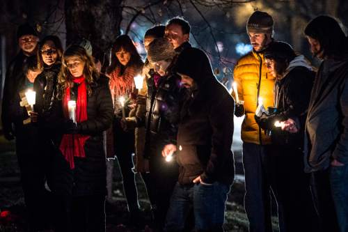 Chris Detrick  |  Tribune file photo
Friends, family and community members participate in a candlelight vigil for James Barker near 2nd Avenue and I Street Thursday on January 15, 2015.  Barker was shot and killed by a Salt Lake City police officer last week.after the man began hitting the officer with a snow shovel.