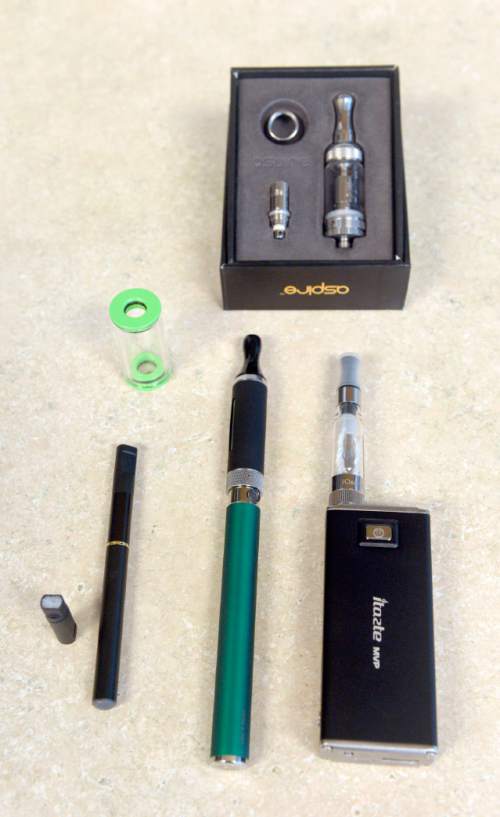 Al Hartmann  |  The Salt Lake Tribune
Examples of first though third generations of e-cigarettes from left to right.  The devices continue to gain in popularity as the state of Utah and local health departments clamp down, trying to keep them away from children and teenagers and ensure the labels show the true content of nicotine.
The governor wants to tax e-cigarettes, and Utah lawmakers are likely to take up legislation again.