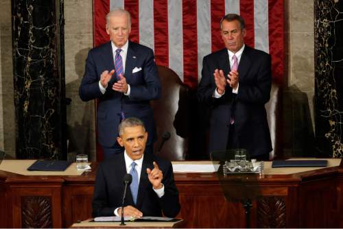 Vice President Joe Biden and House Speaker John Boehner of Ohio applaud President Barack Obama, on  Capitol Hill in Washington, Tuesday, Jan. 20, 2015, during his State of the Union address before a joint session of Congress. (AP Photo/J. Scott Applewhite)