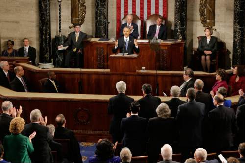 President Barack is applauded on  Capitol Hill in Washington, Tuesday, Jan. 20, 2015, during his State of the Union address before a joint session of Congress. (AP Photo/J. Scott Applewhite)