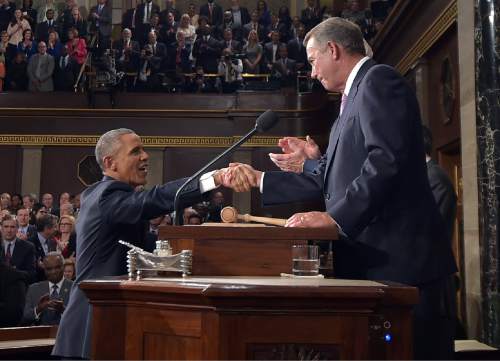 President Barack Obama shakes hands with House Speaker John Boehner as he arrives to deliver his State of the Union address to a joint session of Congress on Capitol Hill on Tuesday, Jan. 20, 2015, in Washington. (AP Photo/Mandel Ngan, Pool)