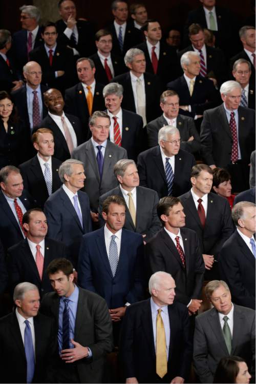 Republian members of Congress wait on  Capitol Hill in Washington, Tuesday, Jan. 20, 2015, for the start of President Barack Obama's State of the Union address before a joint session of Congress. (AP Photo/Pablo Martinez Monsivais)