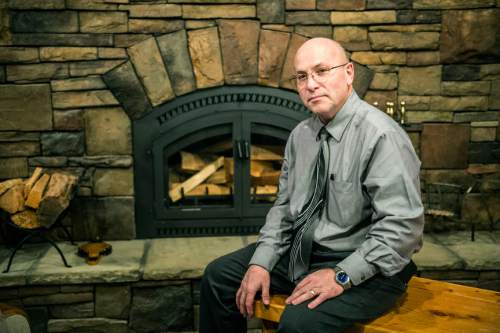 Chris Detrick  |  The Salt Lake Tribune
John Mortensen, of Energy Distribution Systems, poses for a portrait at Rocky Mountain Stove and Fireplace in Brickyard Plaza Friday January 16, 2015.