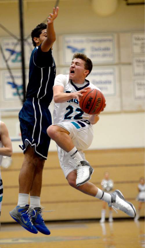 Steve Griffin  |  The Salt Lake Tribune


Juan Diego's Gabe Colosimo drives to the basket as Hunter's Noah Togiai tries to block his shot during basketball game at Juan Diego Catholic High School in Draper, Utah Wednesday, December 11, 2013.