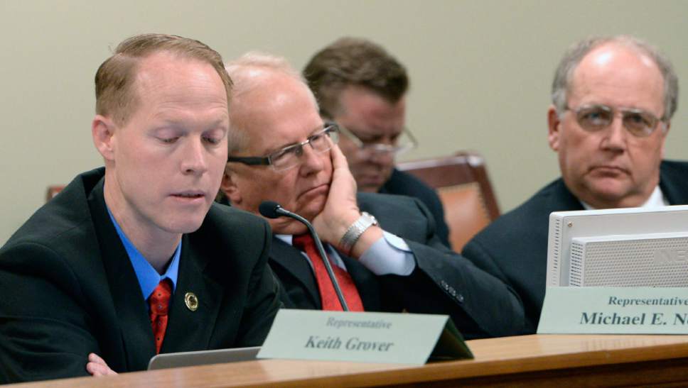 Al Hartmann  |  The Salt Lake Tribune 
Rep. Keith Grover, R-Provo,left, Rep. Michael Noel, R- Kanab, and Rep. John Mathis, R-Vernal listen to testimony in the House Government Operations Standing Committee Monday March 3 on SB005401, Elections Amendments.    The amended bill passed unananimously in the committee to bring it to the house floor.   Many on the committee like these three had reservations but voted for the so-called "Utah count my vote" compromise bill.