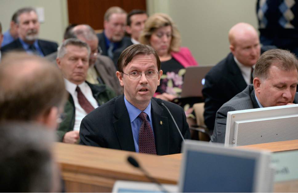 Al Hartmann  |  The Salt Lake Tribune 
Former Utah legislator Freed Cox testifies in the House Government Operation Standing Committee Monday March 3 on SB005401, Elections Amendments sponsored by Senator Curtis Bramble at right.  The amended bill passed unananimously in the committee.   Many on the committee had reservations but voted for the so-called "Utah count my vote" compromise bill.