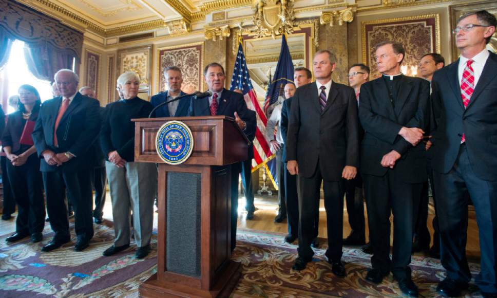 Steve Griffin  |  The Salt Lake Tribune

Gov. Gary Herbert addresses the media as he releases his detailed Healthy Utah plan, which is an alternative way to expanding health care coverage for the poor without technically expanding Medicaid. The plan was hammered out in months of negotiation this year with the U.S. Department of Health and Human Services. He was joined in the Gold Room at the Utah State Capitol by city and state leaders in Salt Lake City, Thursday, December 4, 2014.