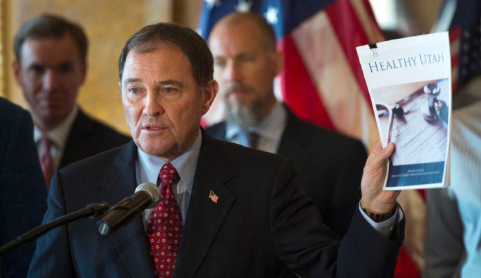 Steve Griffin  |  The Salt Lake Tribune

Gov. Gary Herbert addresses the media as he releases his detailed Healthy Utah plan, which is an alternative way to expanding health care coverage for the poor without technically expanding Medicaid. The plan was hammered out in months of negotiation this year with the U.S. Department of Health and Human Services. He was joined in the Gold Room at the Utah State Capitol by city and state leaders in Salt Lake City, Thursday, December 4, 2014.