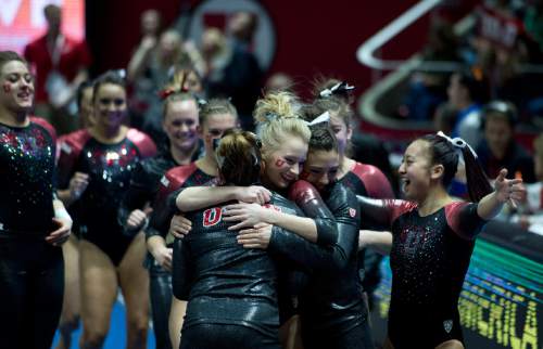 Lennie Mahler  |  The Salt Lake Tribune
Georgia Dabritz is congratulated by teammates after her 9.875 routine on the vault in a super meet at the Huntsman Center on Friday, Jan. 16, 2015.
