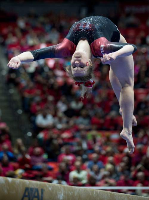 Lennie Mahler  |  The Salt Lake Tribune
Tory Wilson earns a 9.8 on her beam performance during a super meet at the Huntsman Center on Friday, Jan. 16, 2015.