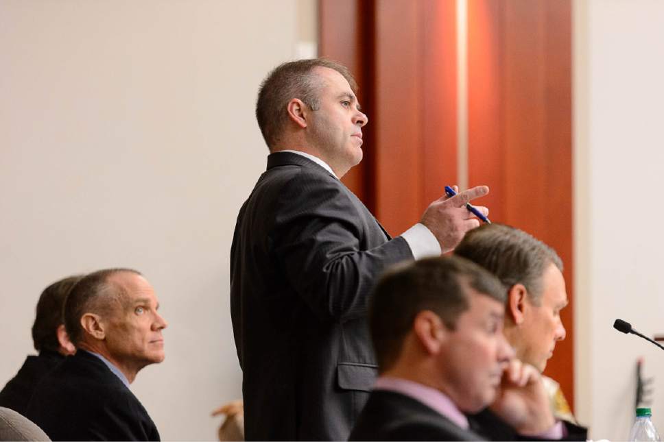 Trent Nelson  |  The Salt Lake Tribune
Marc Sessions Jenson, left, listens to his attorney Marcus Mumford, right, in court in Salt Lake City, Tuesday January 20, 2015. Jenson and his brother, Stephen R. Jenson, are charged with defrauding investors in a luxury ski resort near Beaver, Utah.