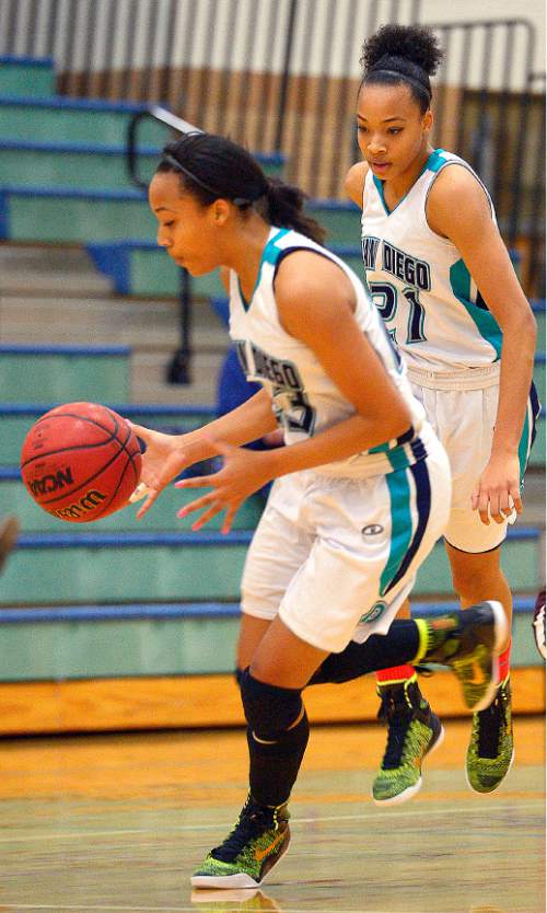 Leah Hogsten  |  The Salt Lake Tribune
l-r Twins Dominque and Monique Mills are a driving force for Juan Diego High School's basketball team. Juan Diego High School girls basketball team defeated Morgan High School 75-55, Friday, January 16, 2015.