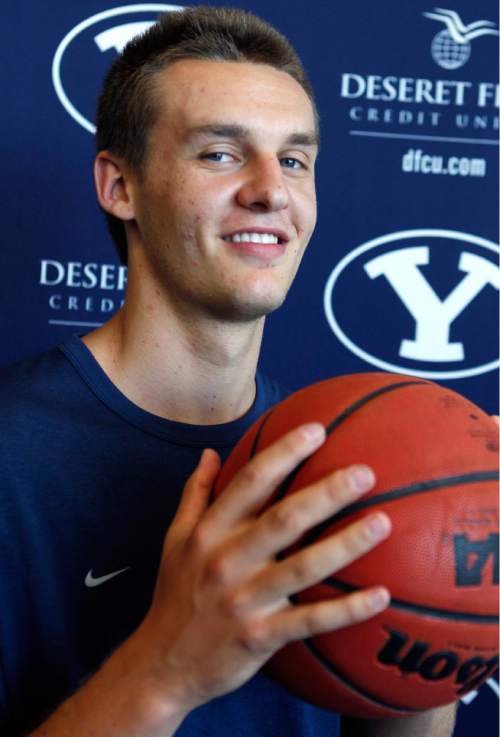 Al Hartmann  |  The Salt Lake Tribune
BYU basketball player Kyle Collinsworth speaks with the media at BYU Tuesday July 23. He recently returned from his church mission to Russia and is expected to contribute immediately to BYU's basketball team this fall.