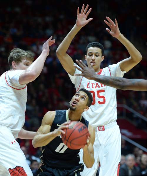 Steve Griffin  |  The Salt Lake Tribune


Colorado Buffaloes guard Askia Booker (0) has no where to go as he gets trapped under the basket by Utah Utes center Dallin Bachynski (31) and Utah Utes forward Kyle Kuzma (35) during second half action in the Utah versus Colorado men's basketball game at the Huntsman Center in Salt Lake City, Wednesday, January 7, 2015.