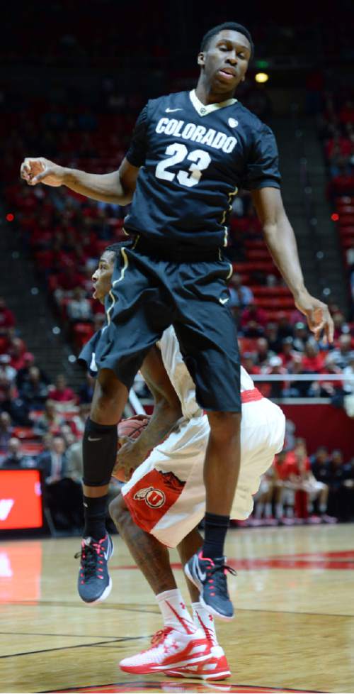 Steve Griffin  |  The Salt Lake Tribune


Colorado Buffaloes guard Jaron Hopkins (23) sails past Utah Utes guard Delon Wright (55) after falling for a pump fake during first half action in the Utah versus Colorado men's basketball game at the Huntsman Center in Salt Lake City, Wednesday, January 7, 2015.