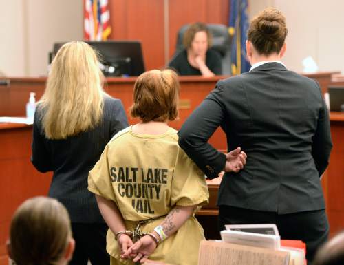 Al Hartmann  |  The Salt Lake Tribune
Alicia Englert, accused of throwing her baby in the trash earlier this month, makes her initial appearance in Judge Ann Boyden's courtroom in Salt Lake City Wednesday Septmeber 10.  Her defense lawyers Susanne Gustin, left, Melissa Fulkerson, right. She is charged with attempted murder.