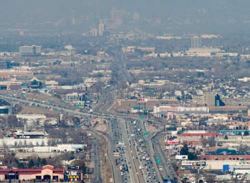 Steve Griffin  |  The Salt Lake Tribune

Downtown Salt Lake City can be seen through the haze as traffic moves along I-15 near in Draper Friday, Jan. 23, 2015.