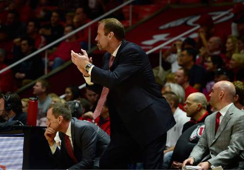Scott Sommerdorf   |  The Salt Lake Tribune
Utah Utes head coach Larry Krystkowiak applauds his team during after two defensive stops in a row with offensive breakaways after. Utah beat Washington 77-56 at the Hunstman Center, Sunday, January 25, 2015.
