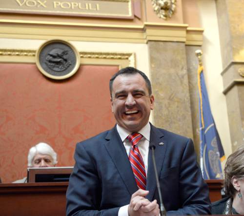 Al Hartmann  |  The Salt Lake Tribune
Greg Hughes, new speaker of the Utah House of Representatives, claps his hands and smiles as he makes his first remarks to the body at the start of the 2015 legislative session on Monday, Jan. 26.