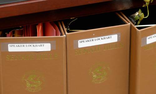 Al Hartmann  |  The Salt Lake Tribune
Former Speaker of the House Becky Lockhart, who recently passed away, still has her name on bill folders that go to the Senate on the first day of the Uath Legislature on Jan. 26, 2015.