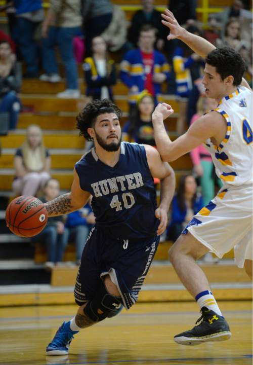 Steve Griffin  |  The Salt Lake Tribune

Hunter's Gabe Lopez drives along the baseline during game between Taylorsville and Hunter at Taylorsville High School in Taylorsville, Tuesday, January 27, 2015.