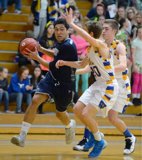 Steve Griffin  |  The Salt Lake Tribune

Hunter's Noah Togiai drives the baseline during game between Taylorsville and Hunter at Taylorsville High School in Taylorsville, Tuesday, January 27, 2015.