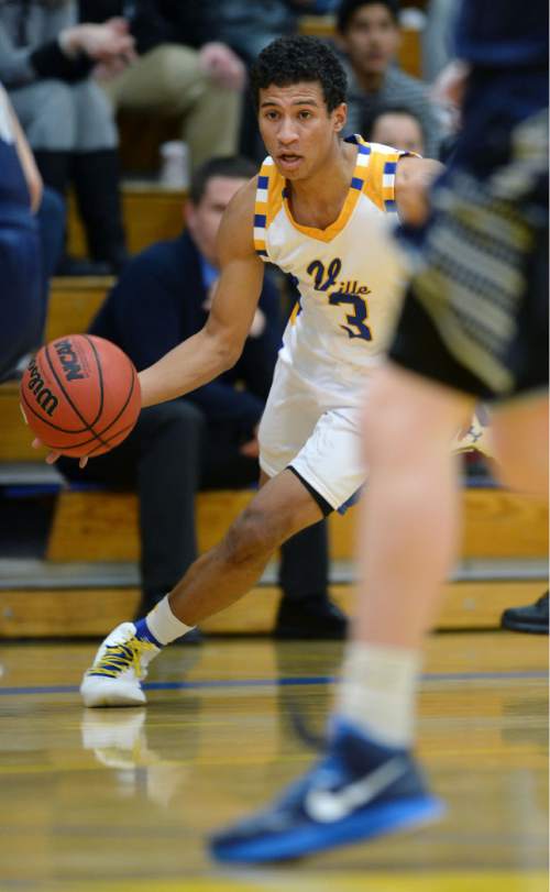 Steve Griffin  |  The Salt Lake Tribune

Taylorsville's Nate Rollins drives up court during game between Taylorsville and Hunter at Taylorsville High School in Taylorsville, Tuesday, January 27, 2015.
