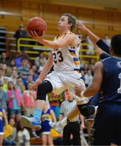 Steve Griffin  |  The Salt Lake Tribune

Taylorsville's Jameson Tonge floats up a left handed layup during game between Taylorsville and Hunter at Taylorsville High School in Taylorsville, Tuesday, January 27, 2015.
