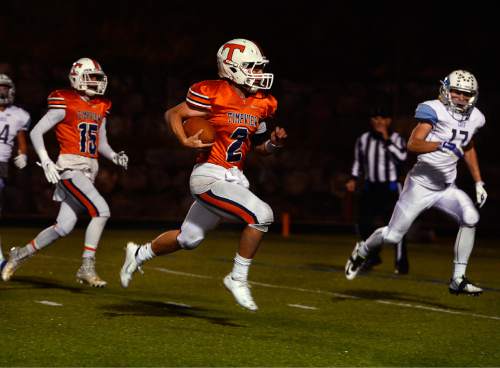 Scott Sommerdorf  |  The Salt Lake Tribune
Timpview QB Britain Covey runs 18 yards for a TD to give Timpview a 38-0 lead. Timpview beat Sky View of Smithfield, 45-8 in a 4A state quarterfinal playoff game Friday, November 7, 2014 in Provo.