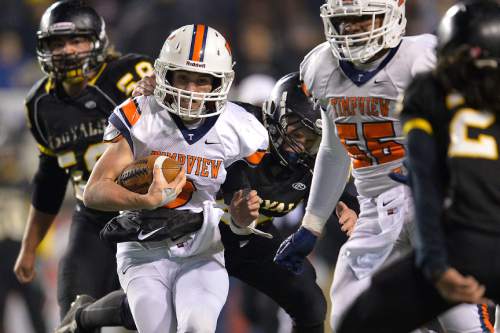 Chris Detrick  |  The Salt Lake Tribune
Timpview's Britain Covey (2) is tackled by Roy's Brandon Storey (44) during the 4A state championship game at Rice-Eccles Stadium Friday November 21, 2014.