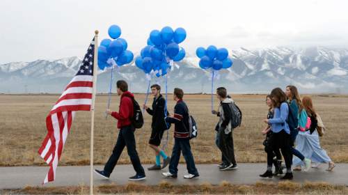 Al Hartmann  |  The Salt Lake Tribune
Students from Frontier Middle School walk to First Anniversary Memorial Event and Park Dedication for Utah County Sheriff's Sgt. Cory Wride, who was fatally shot in the line of duty on Jan. 30, 2014.  The blue balloons were released as a final salute to Wride. 
Eagle Mountain City renamed Mid-Valley Regional Park as Cory B. Wride Memorial Park so that Sgt. Wride's service and sacrifice will always be remembered.