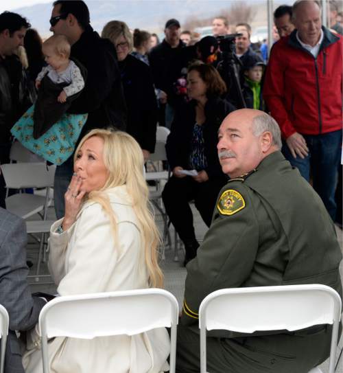 Al Hartmann  |  The Salt Lake Tribune
Nanette Wride, left, and Utah County Sheriff Jim Tracy watch as blue balloons to honor Cory Wride slowly rise into the sky at First Anniversary Memorial Event and Park Dedication for Utah County Sheriff's Sgt. Cory Wride, who was fatally shot in the line of duty on Jan. 30, 2014.  The blue balloons were released as a final salute to Wride. 
Eagle Mountain City renamed Mid-Valley Regional Park as Cory B. Wride Memorial Park so that Sgt. Wride's service and sacrifice will always be remembered.