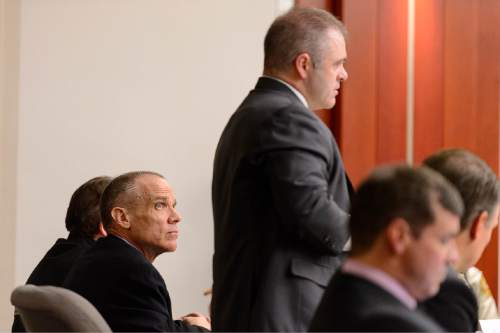 Trent Nelson  |  The Salt Lake Tribune
Marc Sessions Jenson, left, listens to his attorney Marcus Mumford, right, in court in Salt Lake City, Tuesday January 20, 2015. Jenson and his brother, Stephen R. Jenson, are charged with defrauding investors in a luxury ski resort near Beaver, Utah.