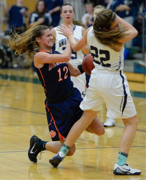 Francisco Kjolseth  |  The Salt Lake Tribune 
Brighton's McCall Christensen winces in pain after rolling her left ankle when she ran into Mikelle Magalogo of Copper Hills in the class 5A game as the No. 2-ranked teams battled it out at Copper Hills in West Jordan on Thursday night, Jan. 29, 2015.